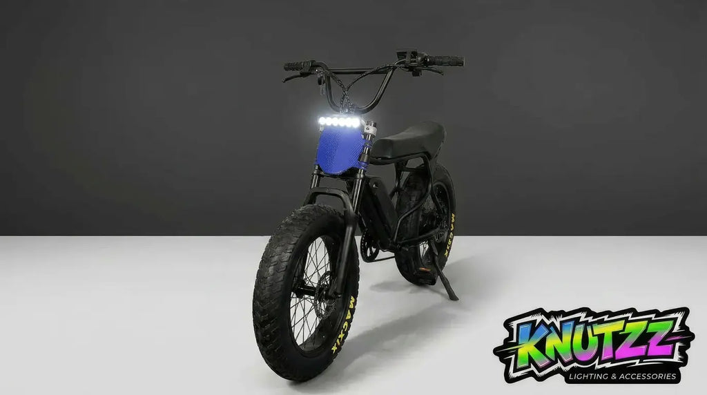 Black Macfox Ebike with blue accents on a white background, featuring the 'Knutzz' lightbar kit