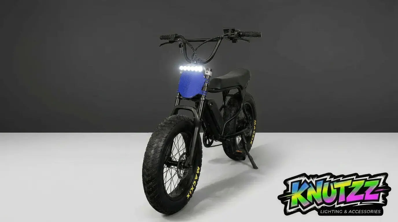 Black Macfox Ebike with blue accents on a white background, featuring the 'Knutzz' lightbar kit